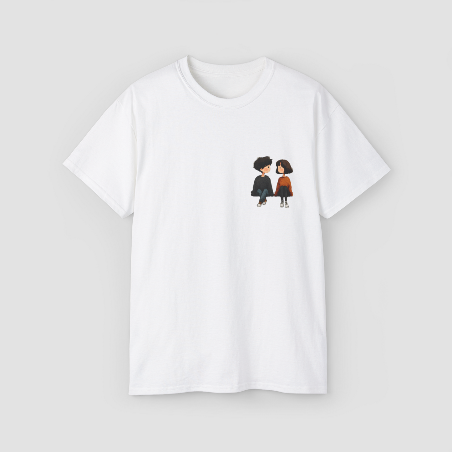 A cute and colorful anime-style couple graphic on the 'You & I' white oversized terry cotton t-shirt.\