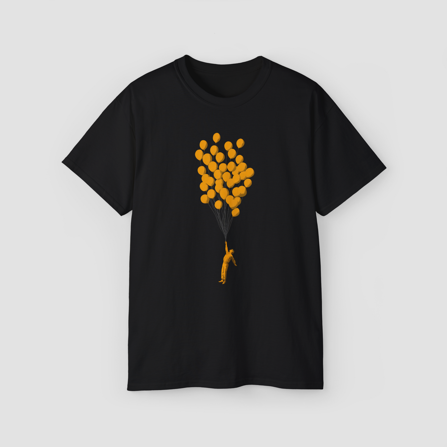 Artistic 'Look, Ma, No Gravity!' graphic with a floating person and yellow balloon on an oversized tee.\
