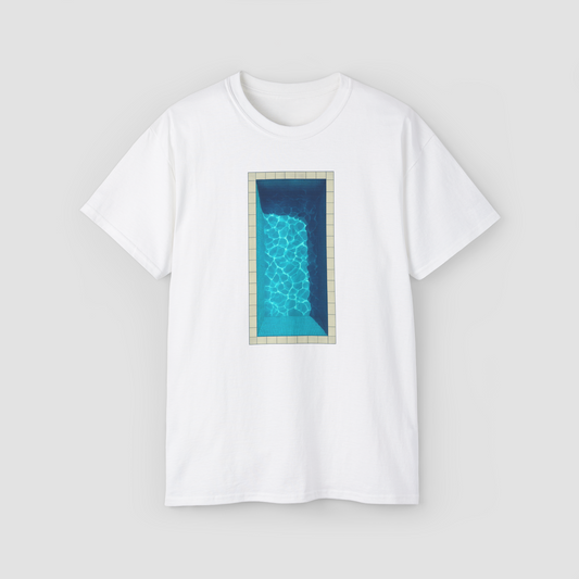 A minimalist graphic of a swimming pool with the text 'Come Take a Dip' on a white oversized t-shirt.\