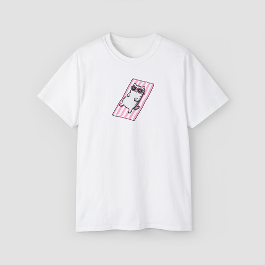 A cute cat in sunglasses lounging on a beach towel, 'I'm a Beach Cat' white oversized t-shirt.\