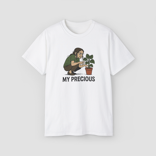 A person holding a plant with the text 'My Precious' on a white oversized terry cotton t-shirt.\