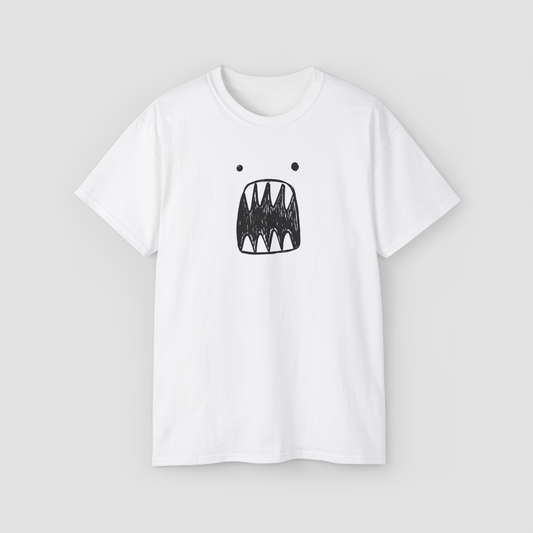 A quirky and minimalist scribble monster face graphic on the 'Scariest Tee' white oversized t-shirt.\